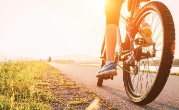 Sun shining on a cyclist